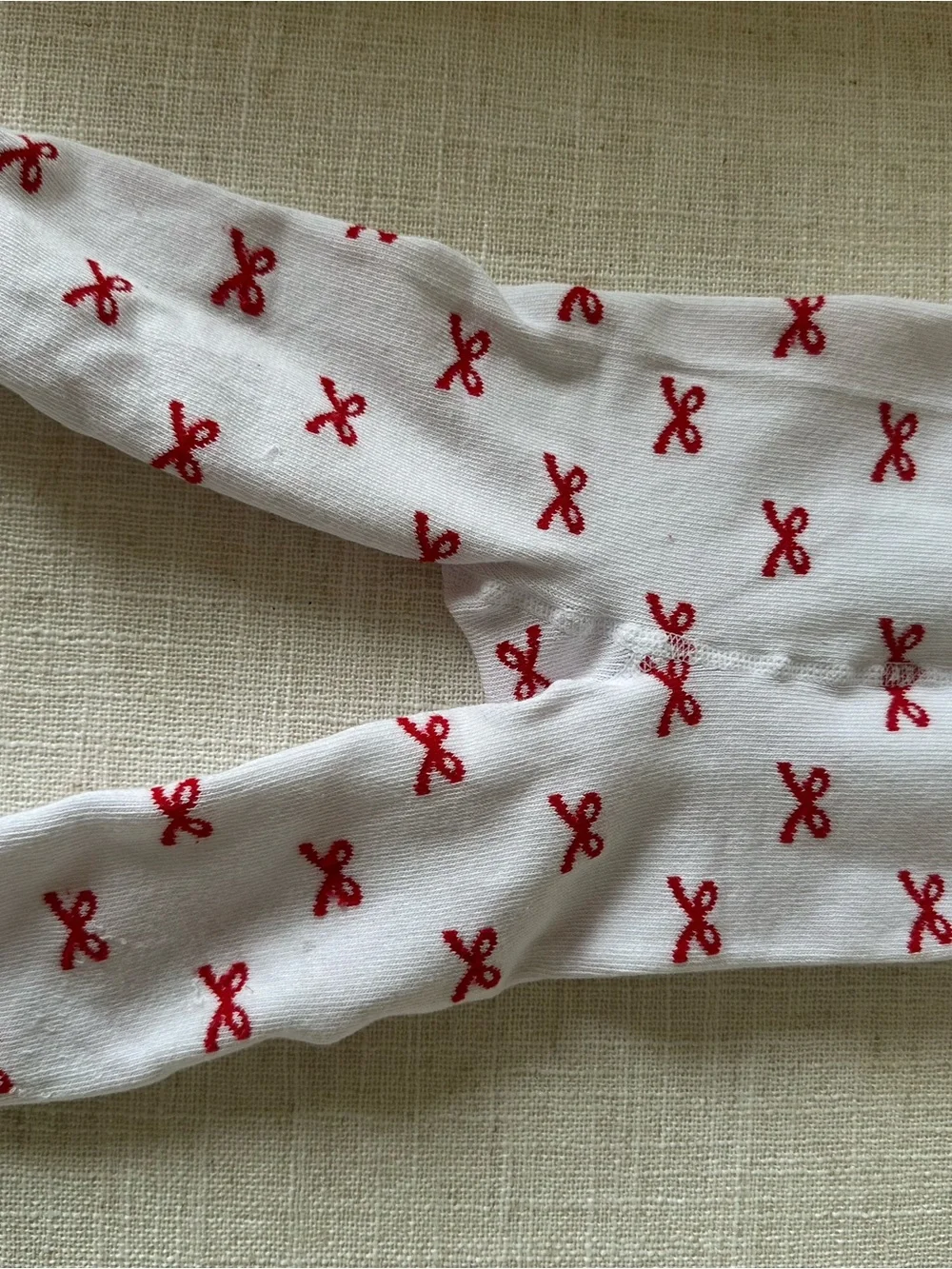 Rufflebutts White Baby/Toddler Footed Tights with Red Bow Pattern